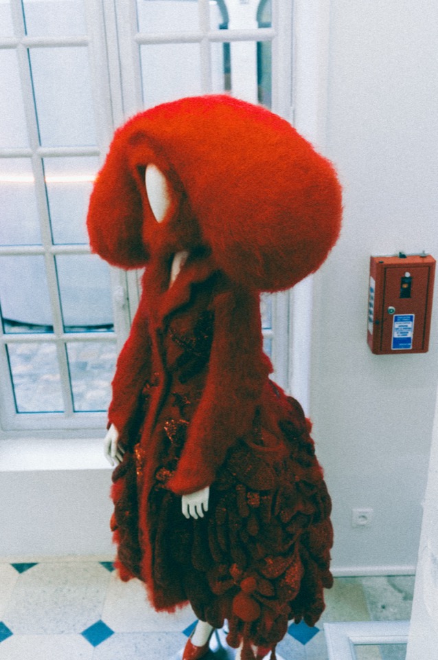 Red fashion headpiece, full view