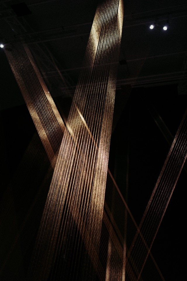 Golden thread installation in darkness